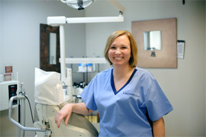 Dr. Amy Van Fossen next to an x-ray machine